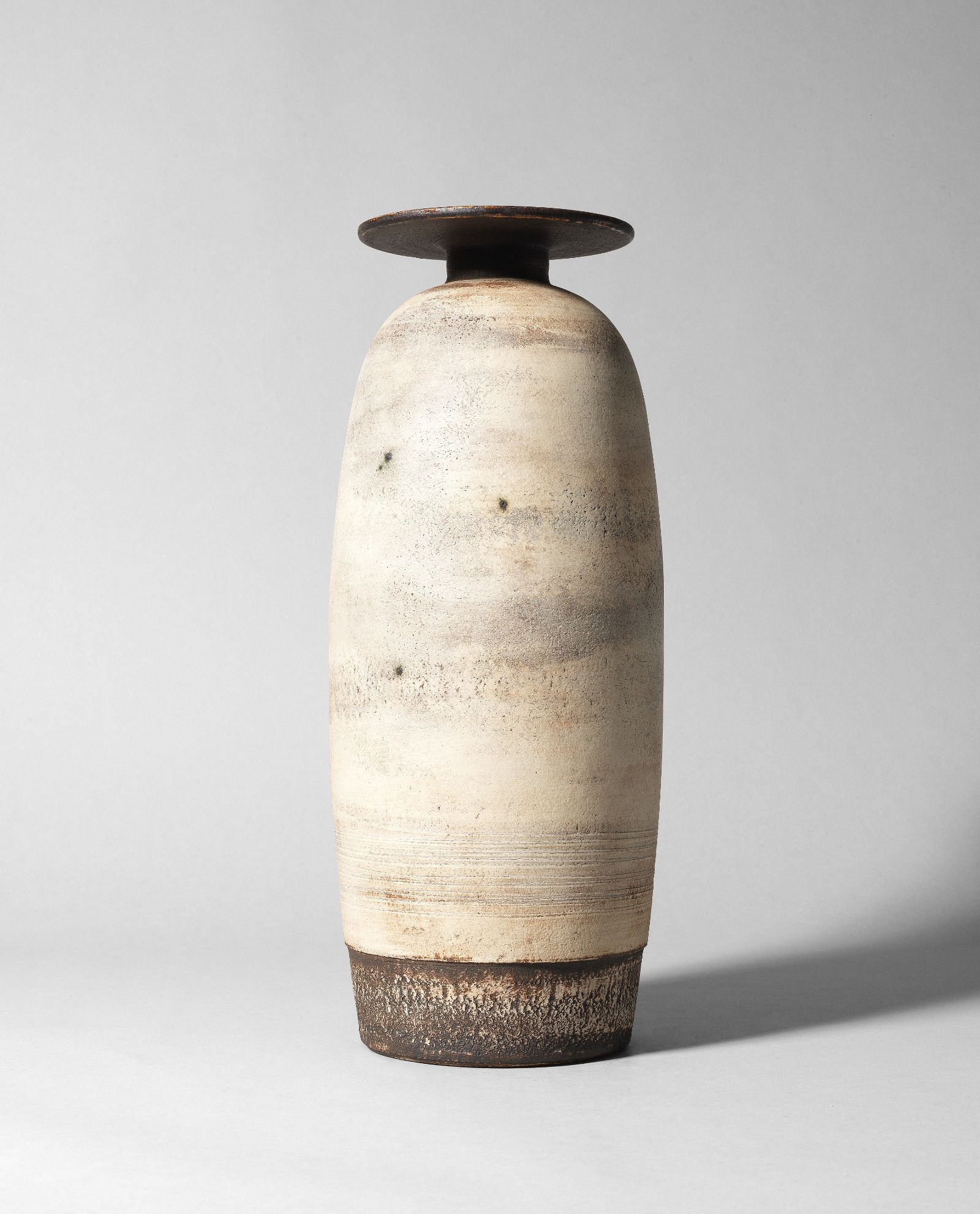 Hans Coper, ‘Tall bottle vase with disc’, circa 1968. (Lot 41, estimate £80,000-120,000, sold for £655,500 inc. premium) COURTESY: Bonhams