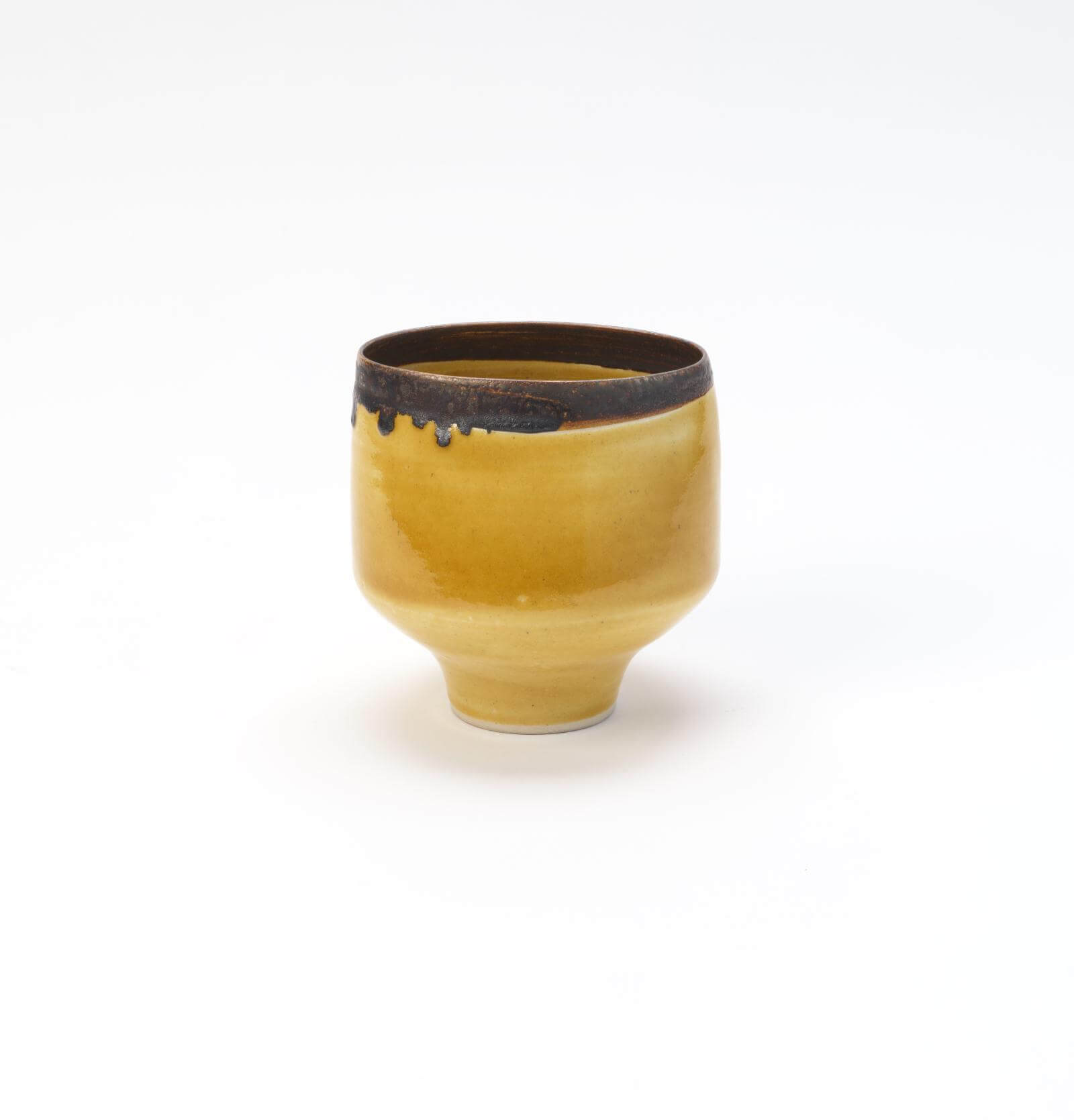 Lucie Rie, ‘Squeezed Yellow Beaker’, circa 1955 COURTESY: © The Artist / the Wingfield Digby Collection / PHOTOGRAPH: Sylvain Deleu
